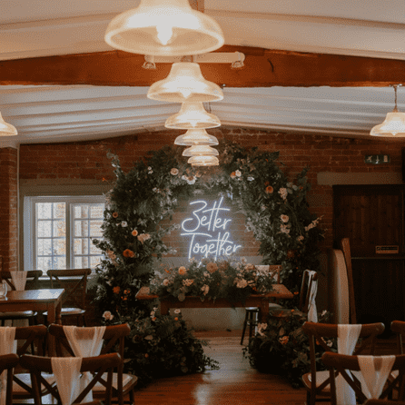 beautifully decorated indoor barn wedding venue